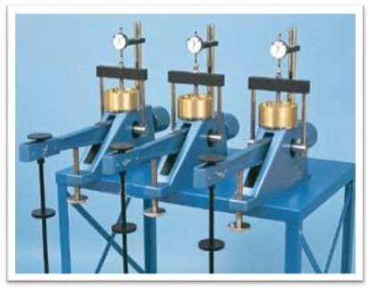 Consolidation apparatus (set of 3 mounted frames on a metallic table)